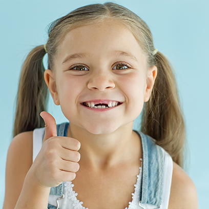 Young girl with black hair laughing