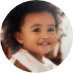 Smiling toddler girl with curly hair