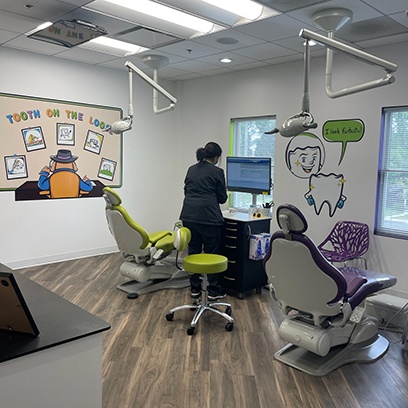 a purple and a green treatment chair in the Tooth Clues office