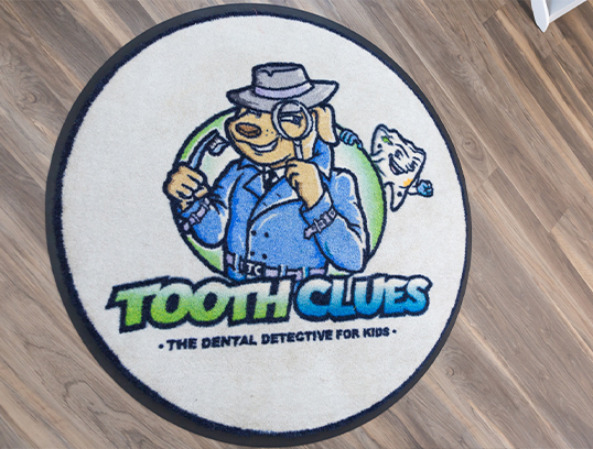 Coaster with logo for Tooth Clues The Dental Detective for Kids