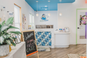 the front desk of the Tooth Clues office with a sign 